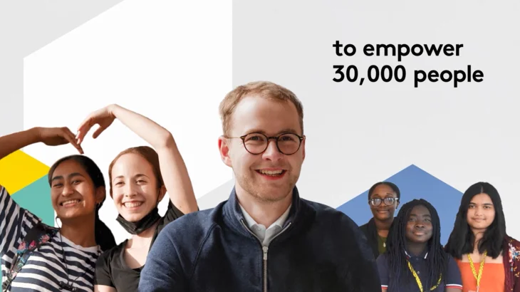 Image overlayed with text "**to empower 30,000 people**," showing a diverse group of smiling young people and an adult male in the foreground.