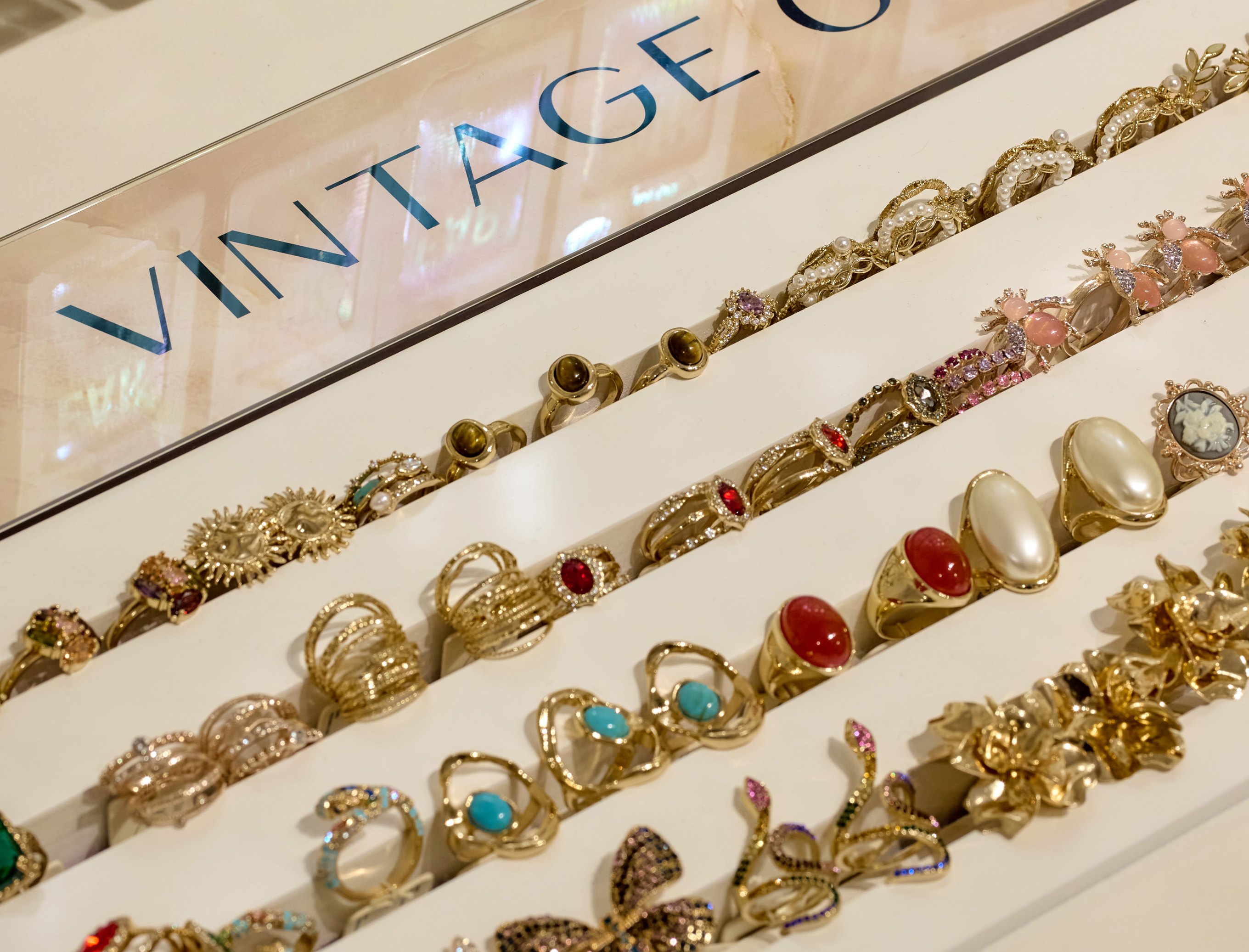 Close up of a selection of vintage glam rings in a Lovisa store