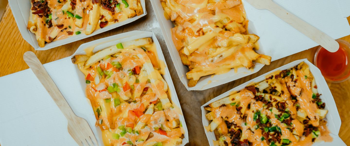 Four boxes of Five Guys new loaded fries