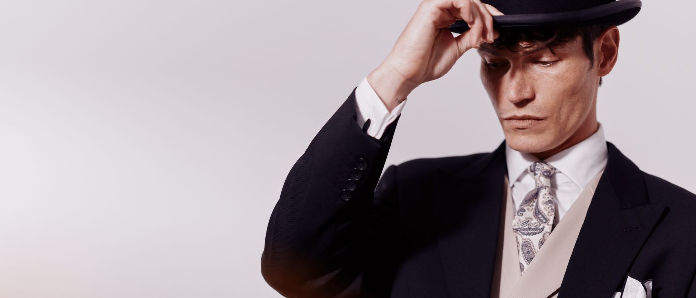 A man wearing a suit and top hat