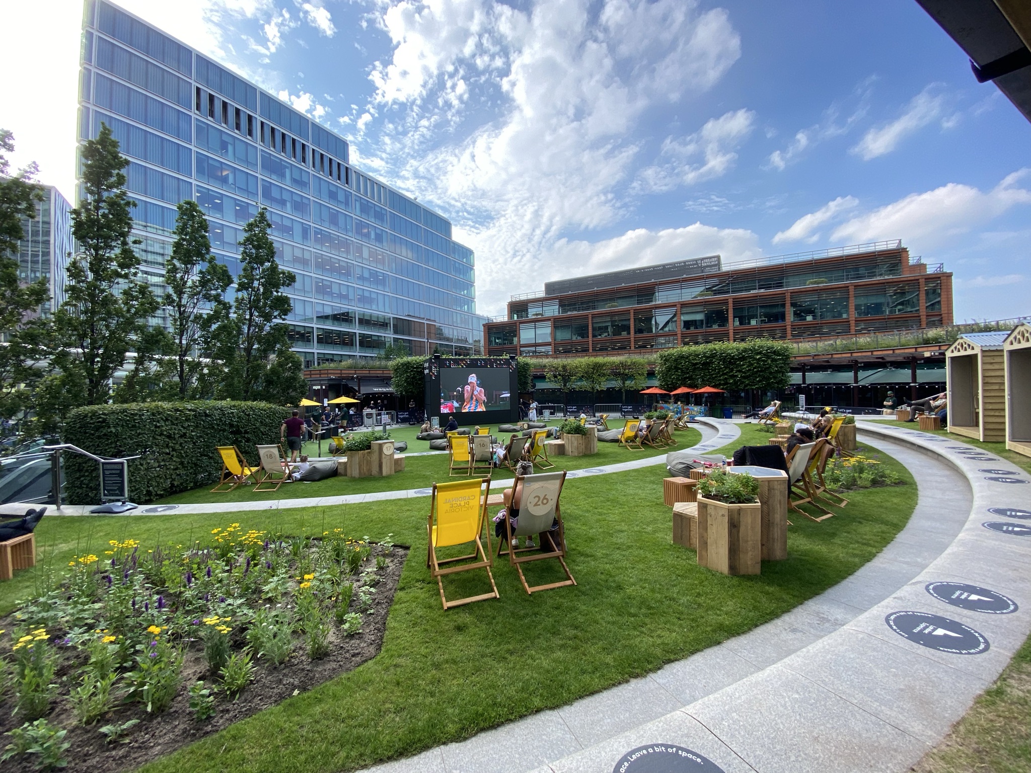 Outside At Victoria London showing deck chairs on the grass
