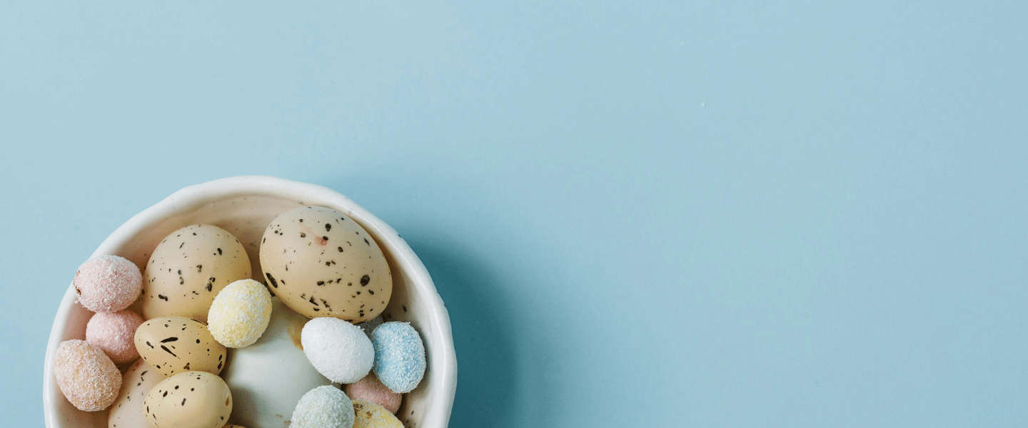 Bowl of mini eggs against a light blue background