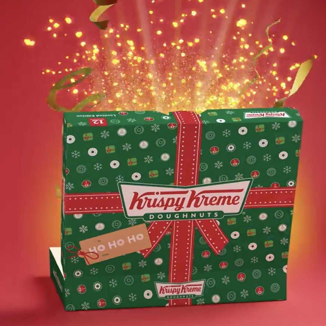 Krispy Kreme doughnut box with with glitter exploding out of it