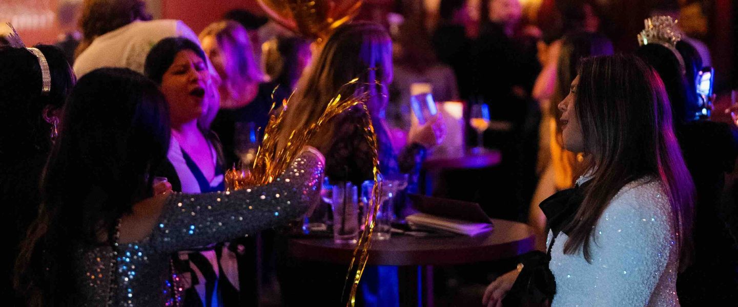 Women in sparkly dresses in BAM Karaoke Box