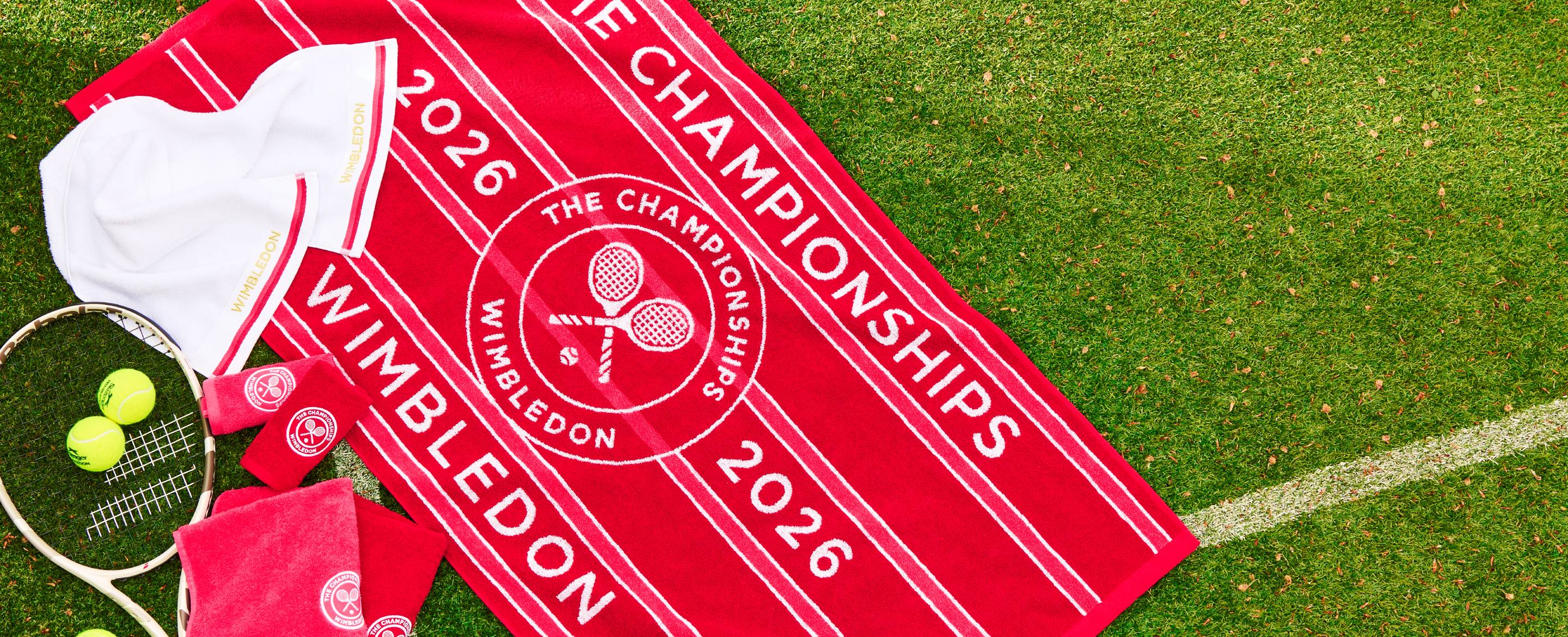 A Christy Wimbledon Championships towel on a tennis court