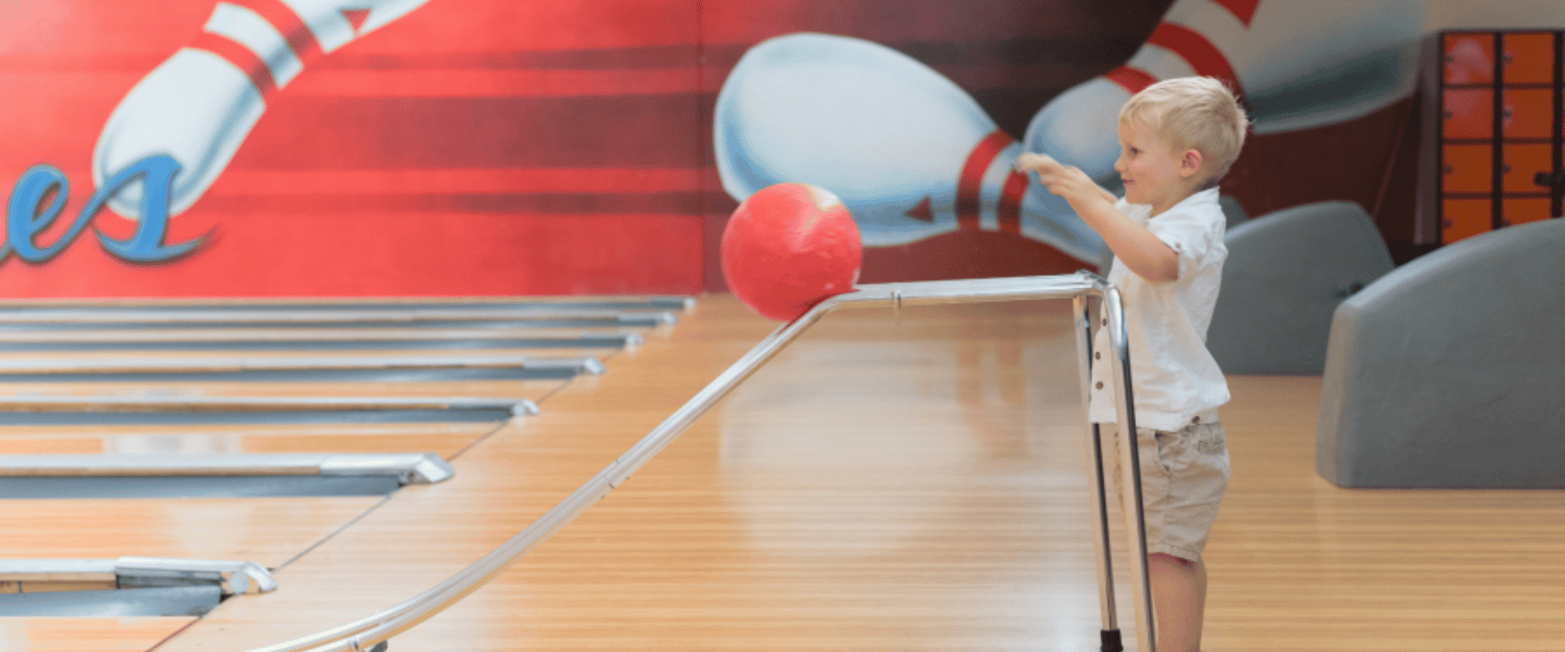 A child bowling