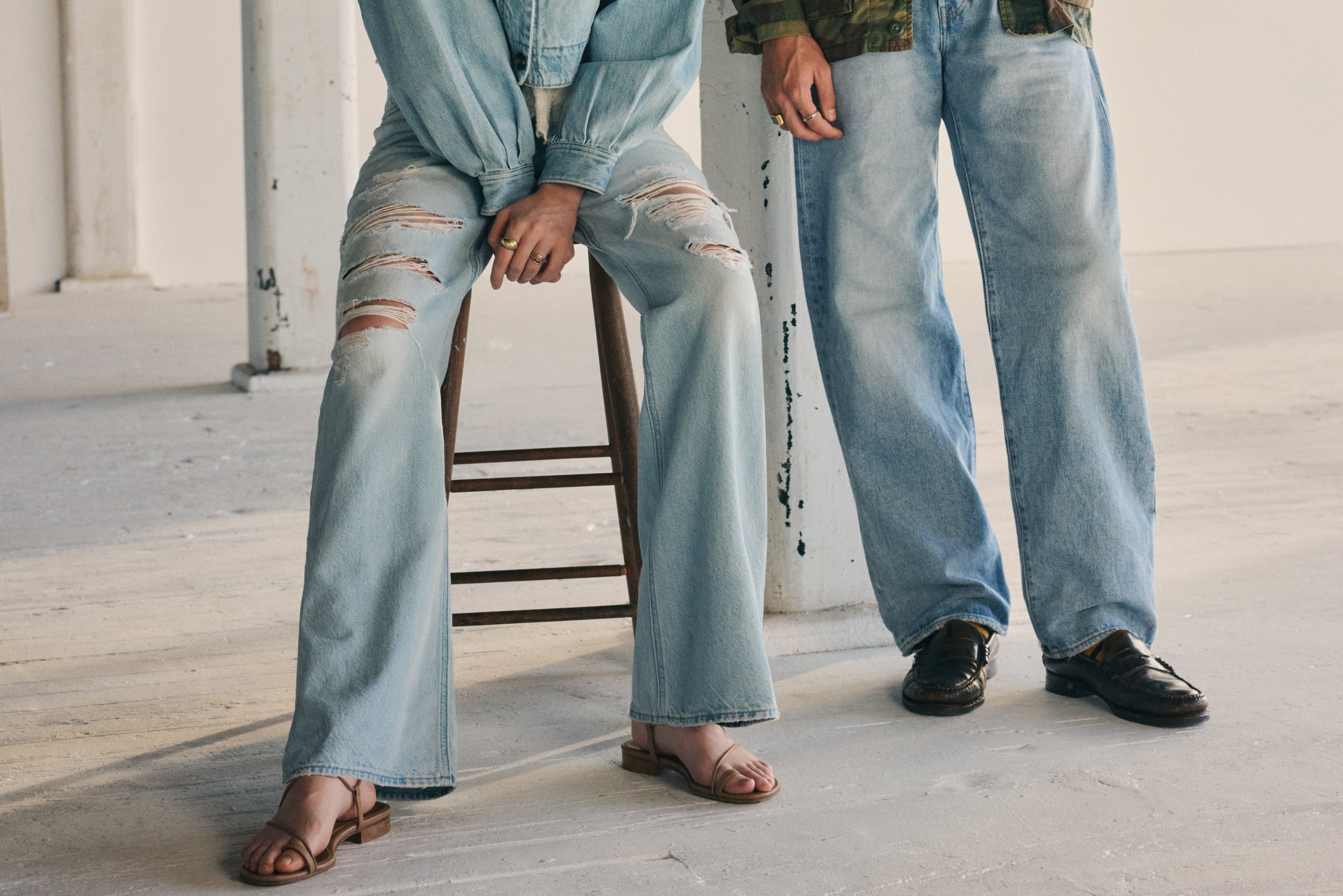 A photograph showcasing two models wearing Levi's jeans