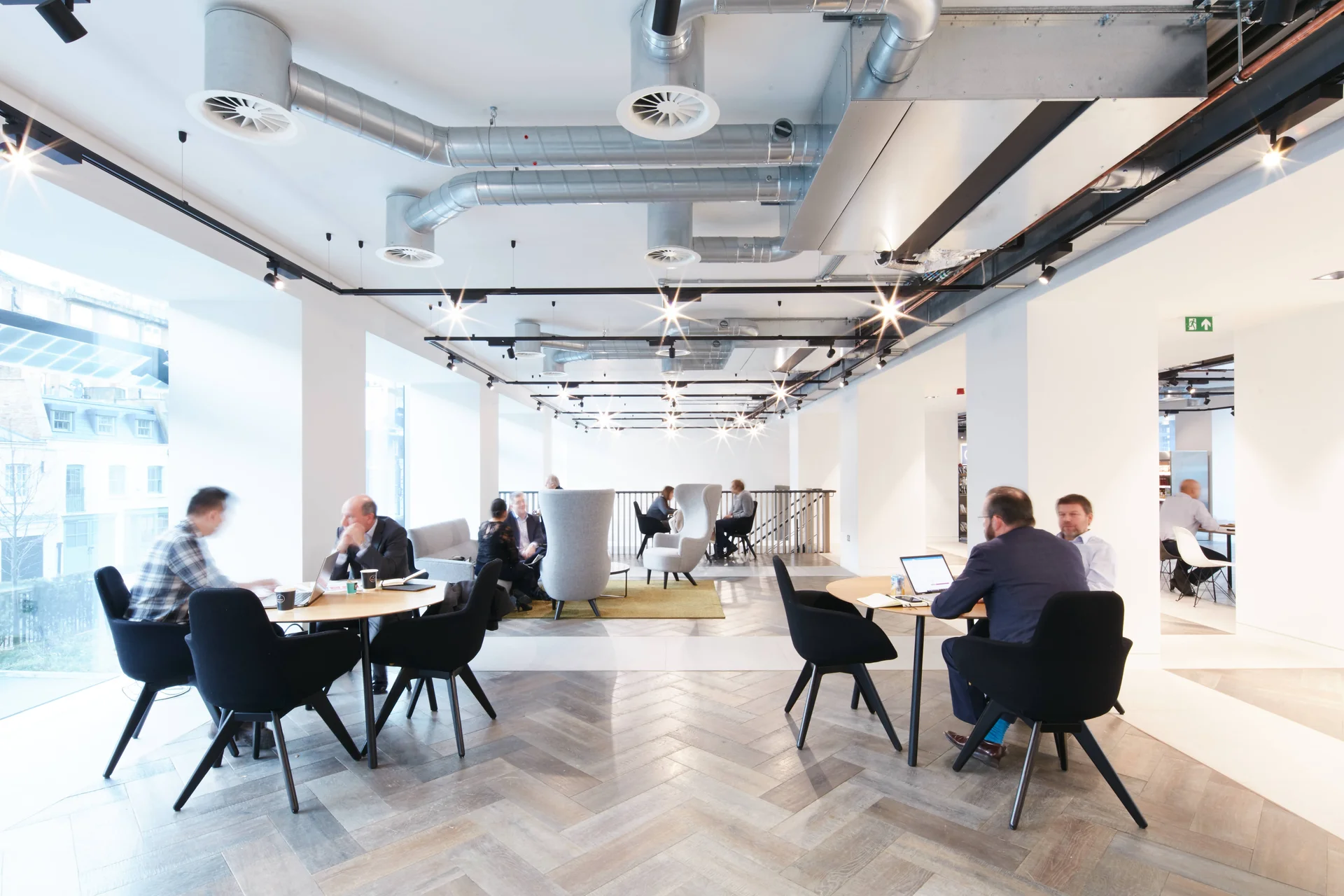 Collaborative office environment with tables and people working