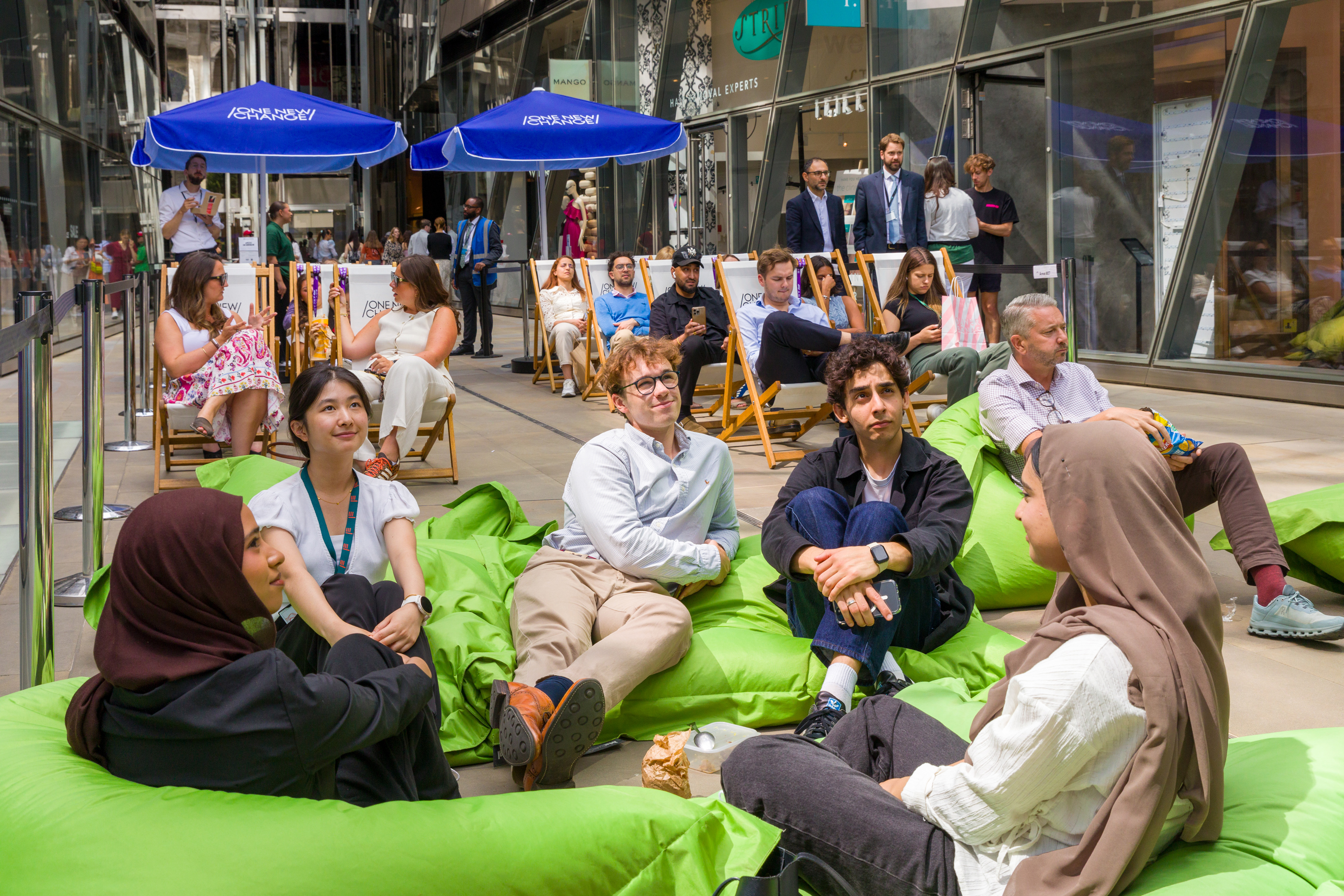People sitting on beanbags watching the tennis at one new change