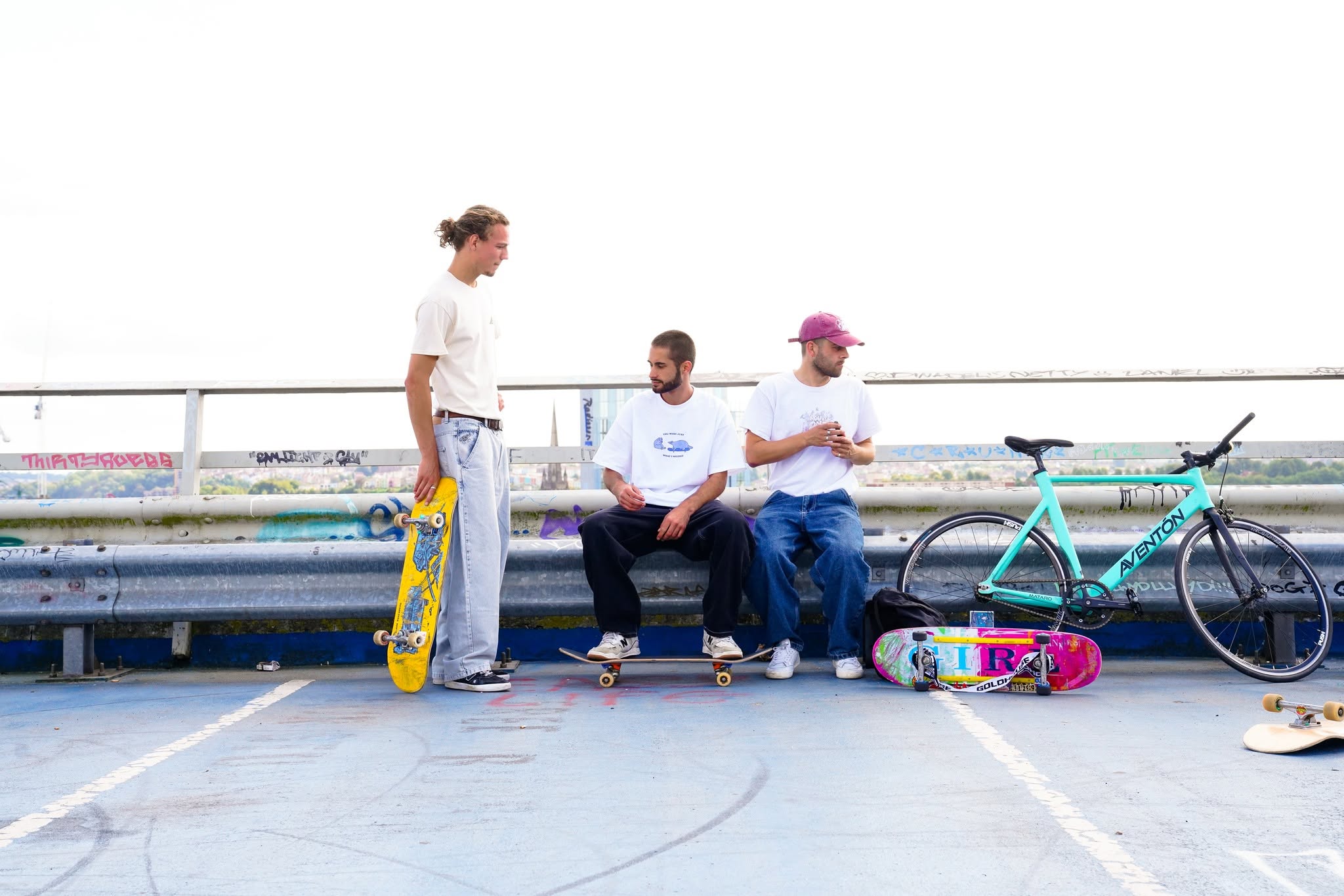 A group of skaters on top of a multi-storey car park