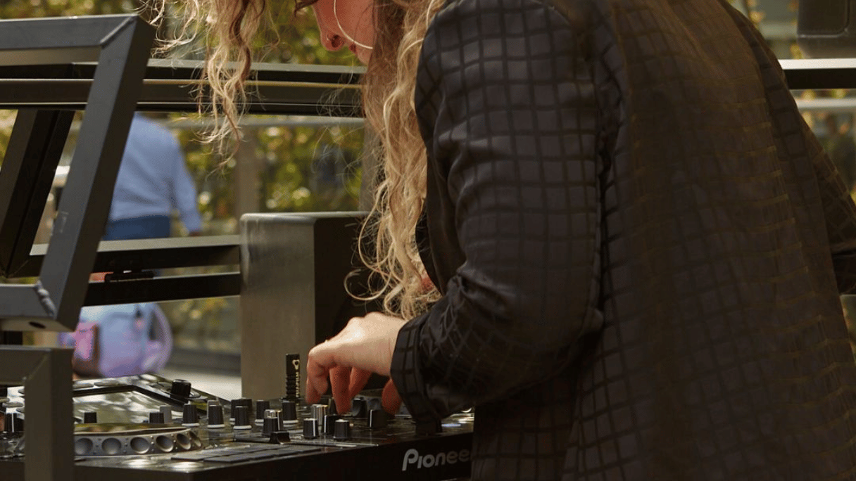 A girl DJing at the Nova Sundowner Sessions