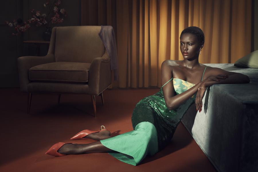 A Zara model wearing a green dress