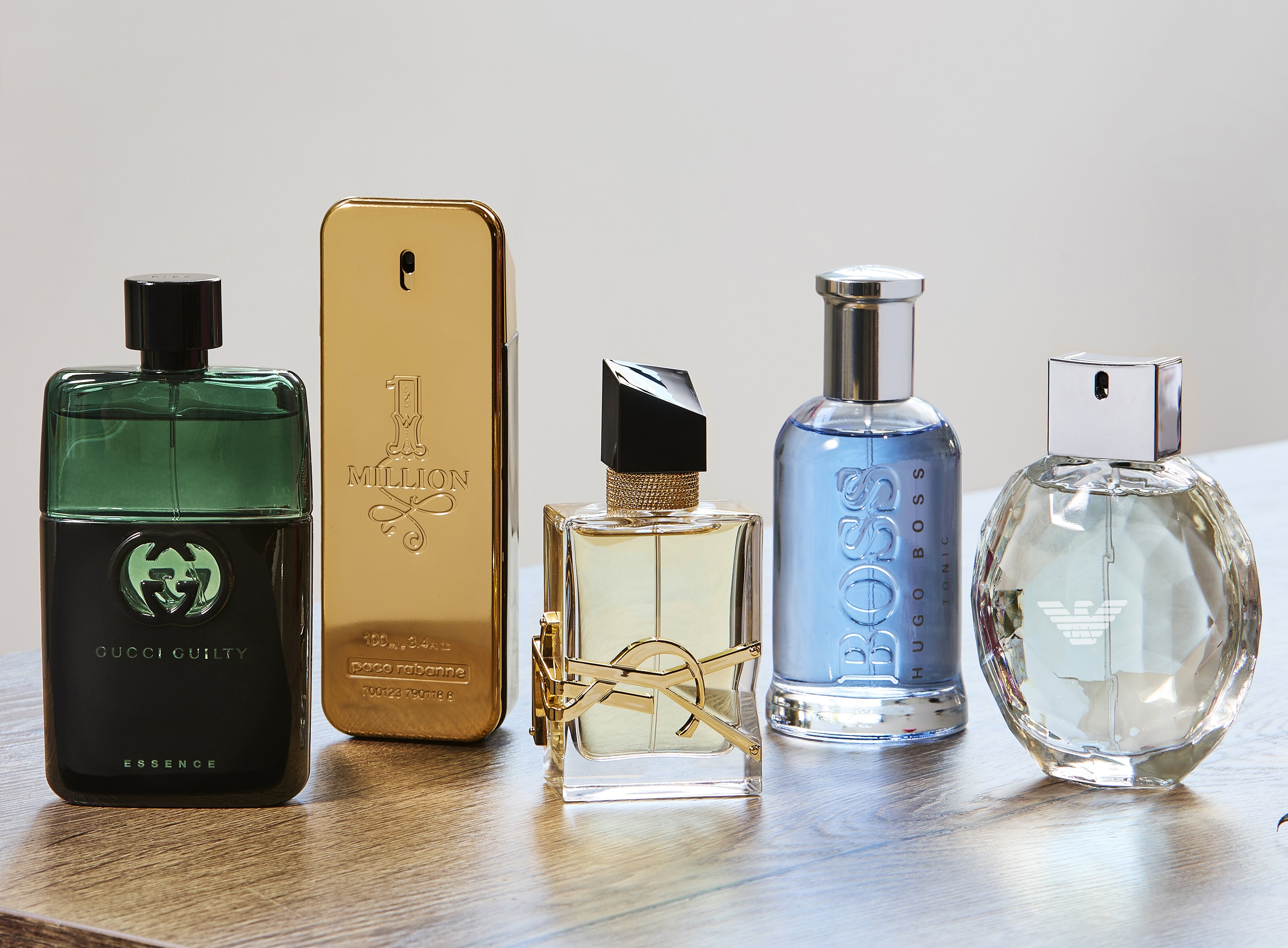 Designer perfume bottles sitting on top of a table