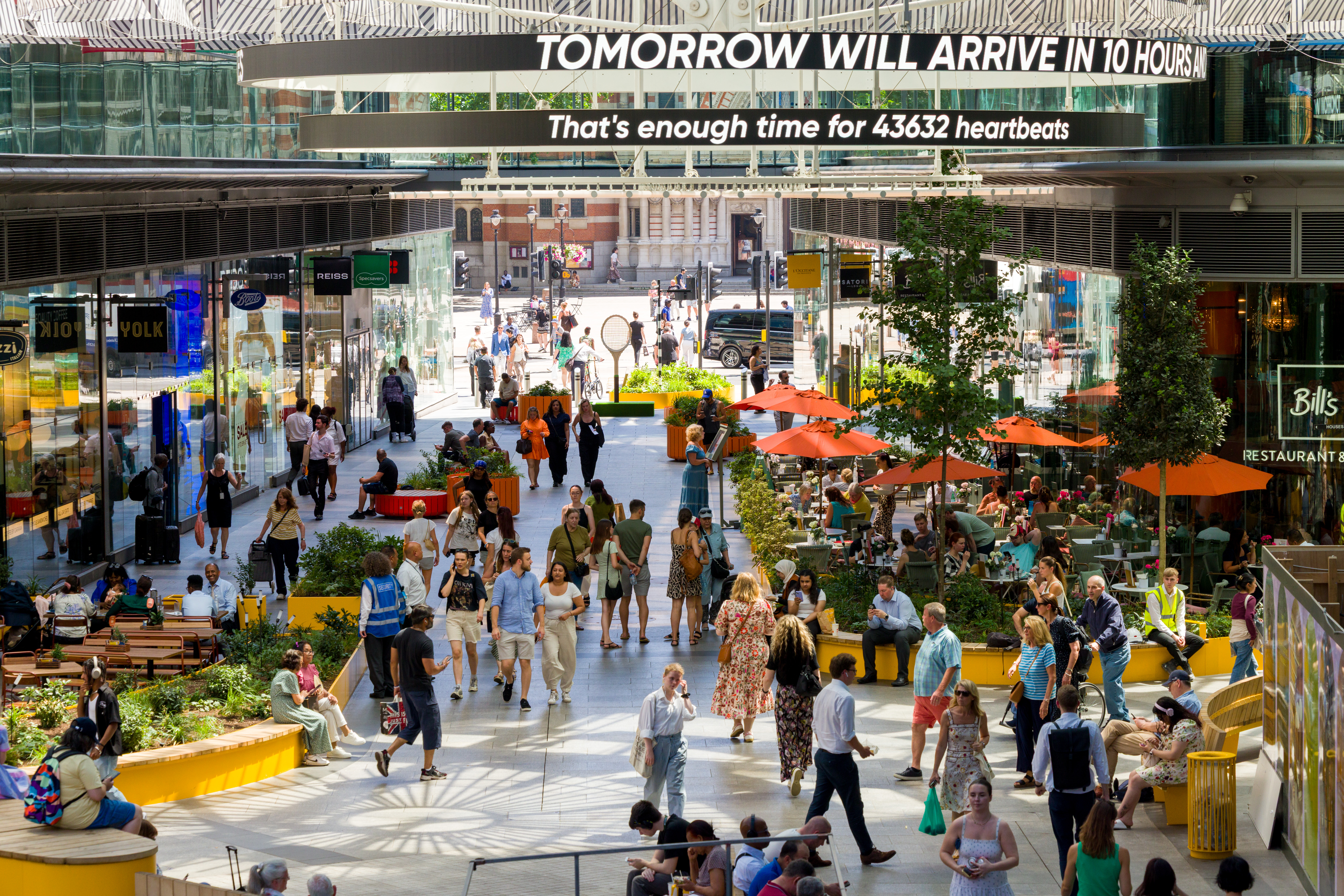People walking through the central arcade at Cardinal Place.