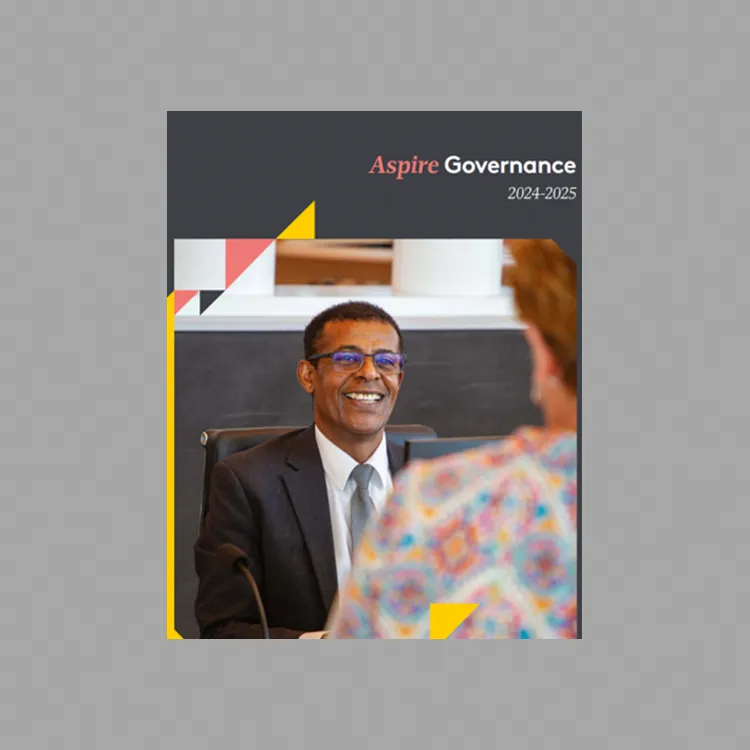 Aspire Governance 2024-2025 cover page with a man in a suit and glasses smiling at a woman, with a bookshelf in the background and geometric shapes.