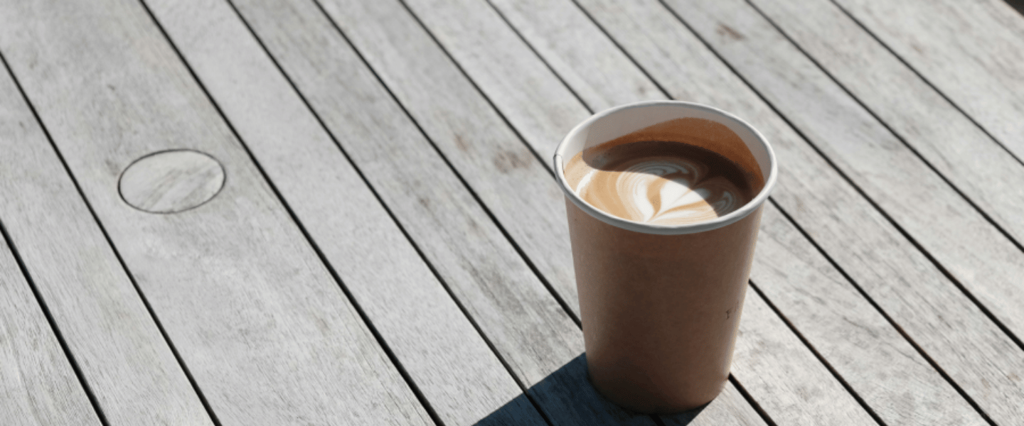 A coffee cup on a wooden table