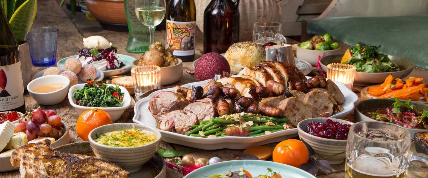 A thanksgiving dinner with turkey and all the sides