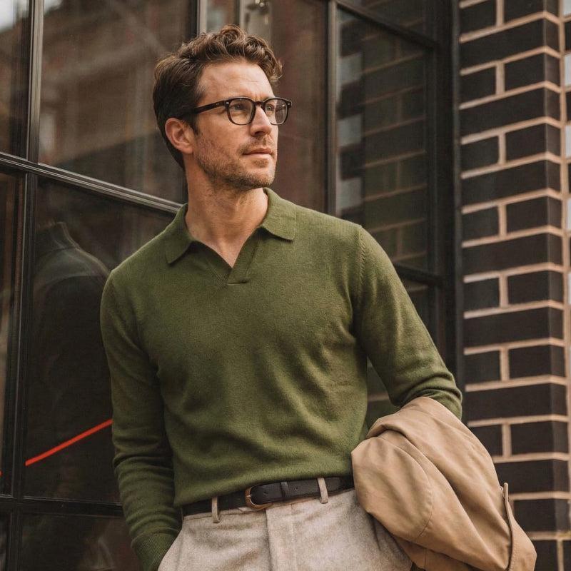 A man wearing a green knitted top