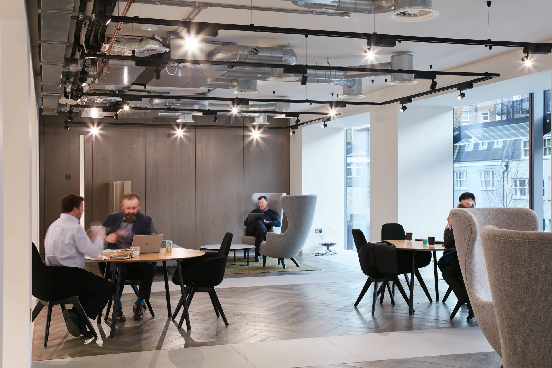 Bright open-plan workspace with several seating arrangements