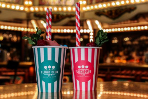 Cocktails in blue and pink striped cups from Flight Club