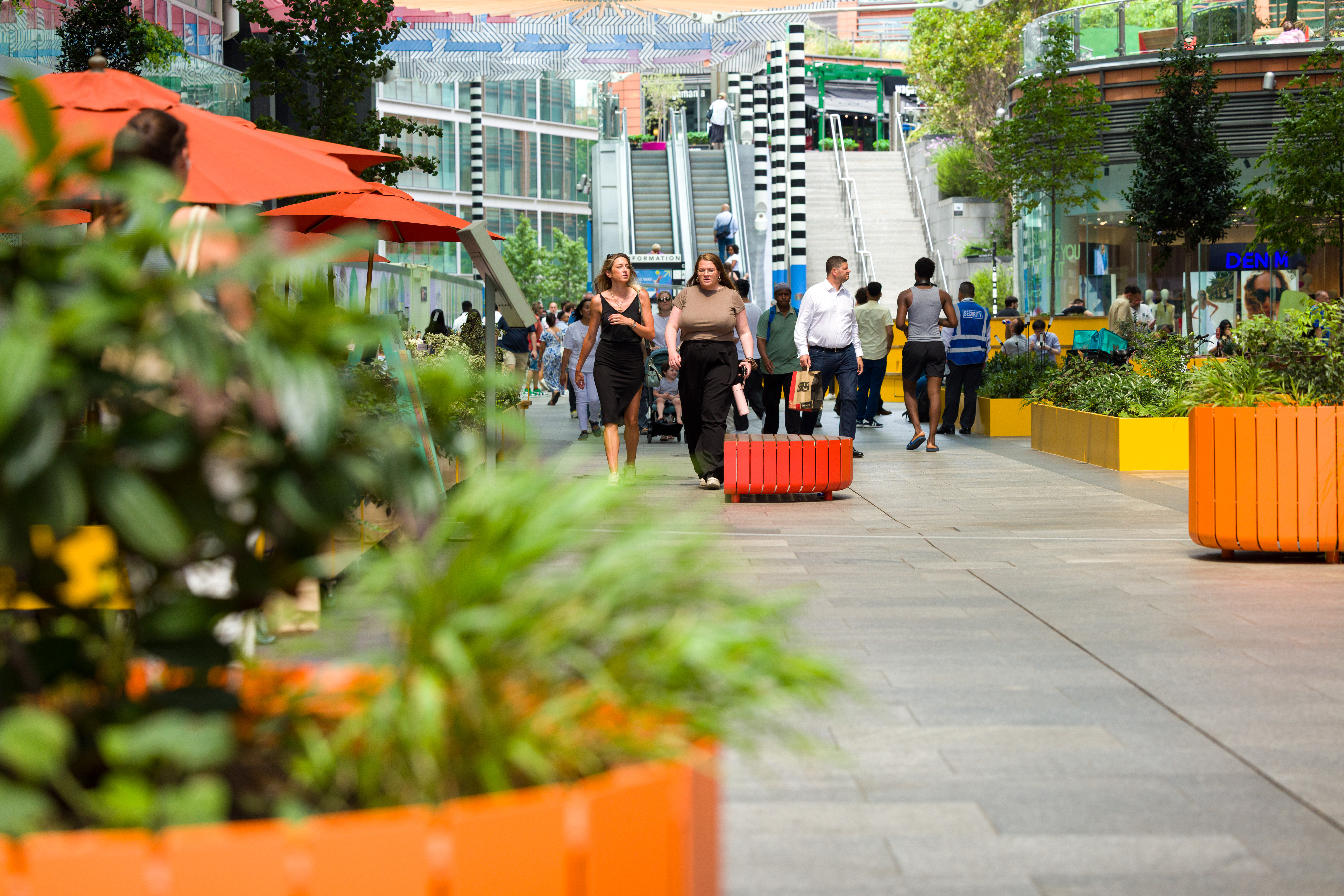 Covered shopping arcade at Cardinal Place with shops and cafés.