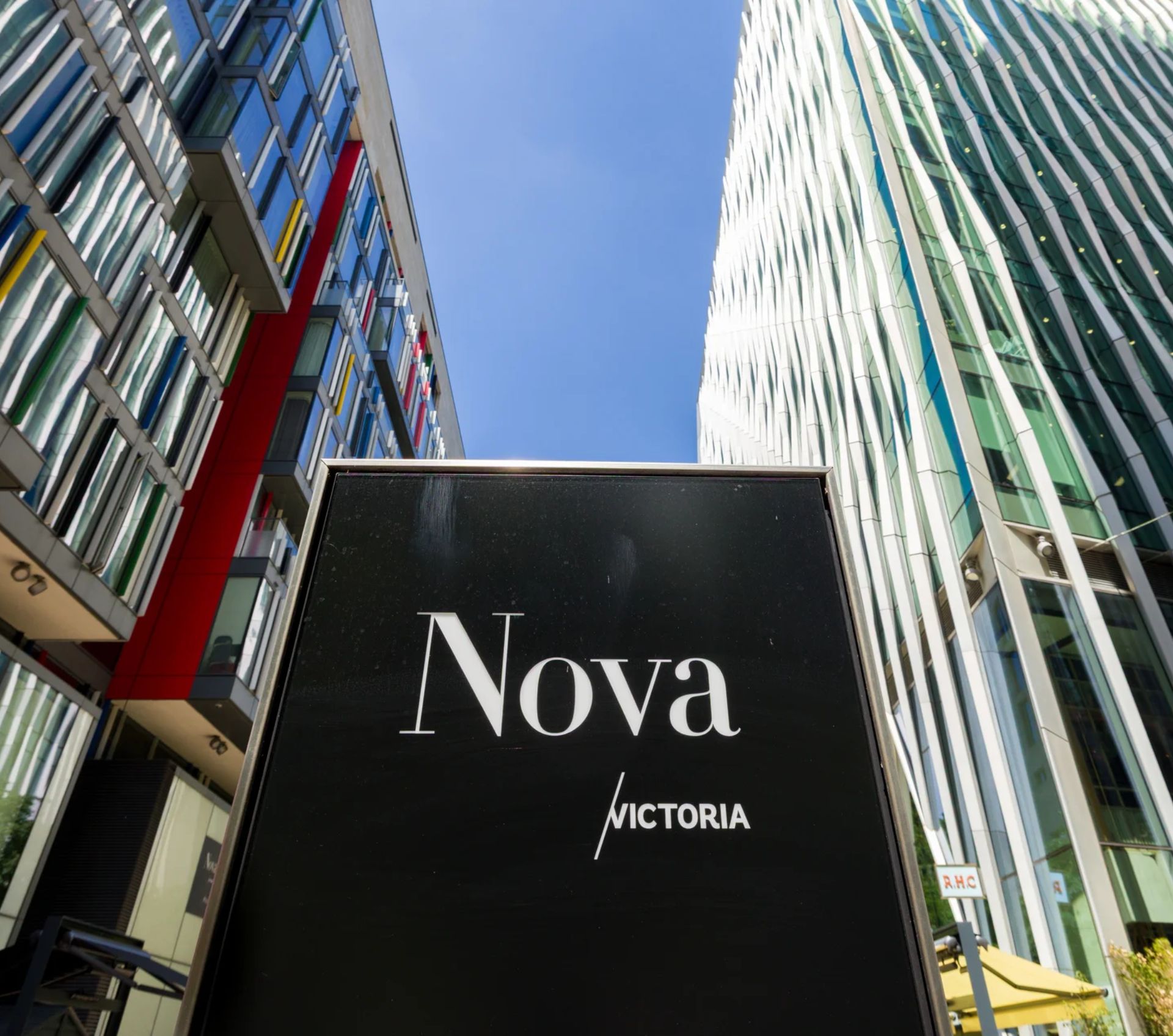 Modern street in Nova Place, Victoria with glass buildings and vibrant colours