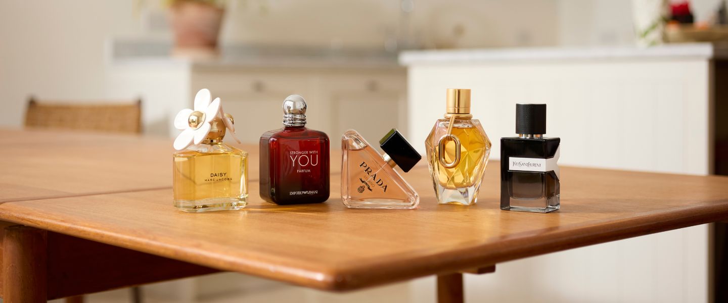 A selection of branded fragrances on a kitchen table