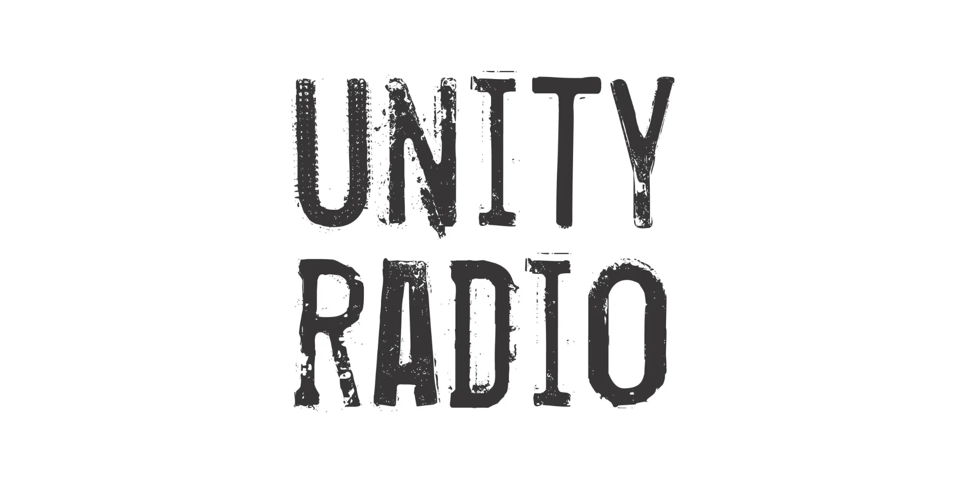 Bold, distressed typography on a white background spells out the black Unity Radio logo, a Manchester-based community station.