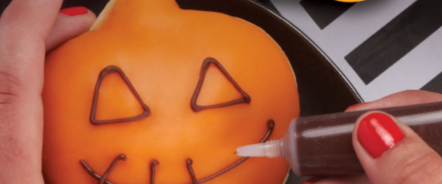 A Krispy Kreme doughnut shaped like a pumpkin