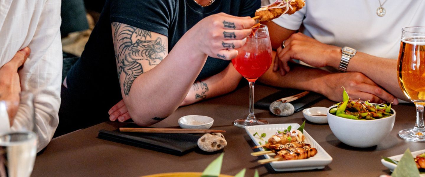 People sharing a sushi platter at Sticks 'n' Sushi