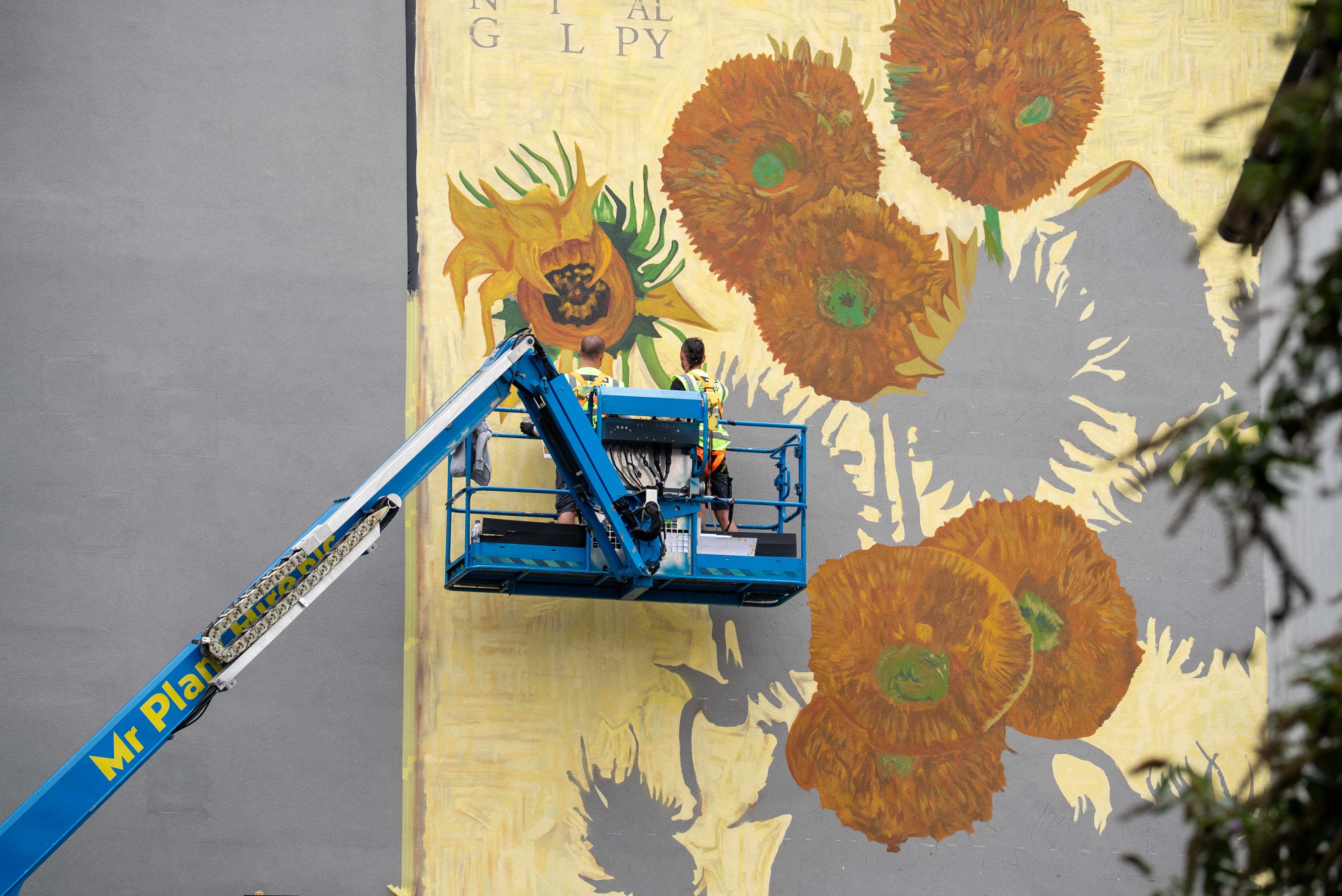 Painting of the Van Gogh Sunflowers mural at Westgate Oxford.