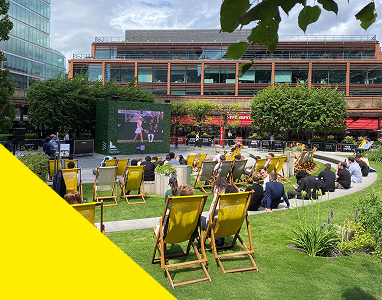 Deck chairs in The Garden at Victoria with a yellow triangle in the bottom left corner