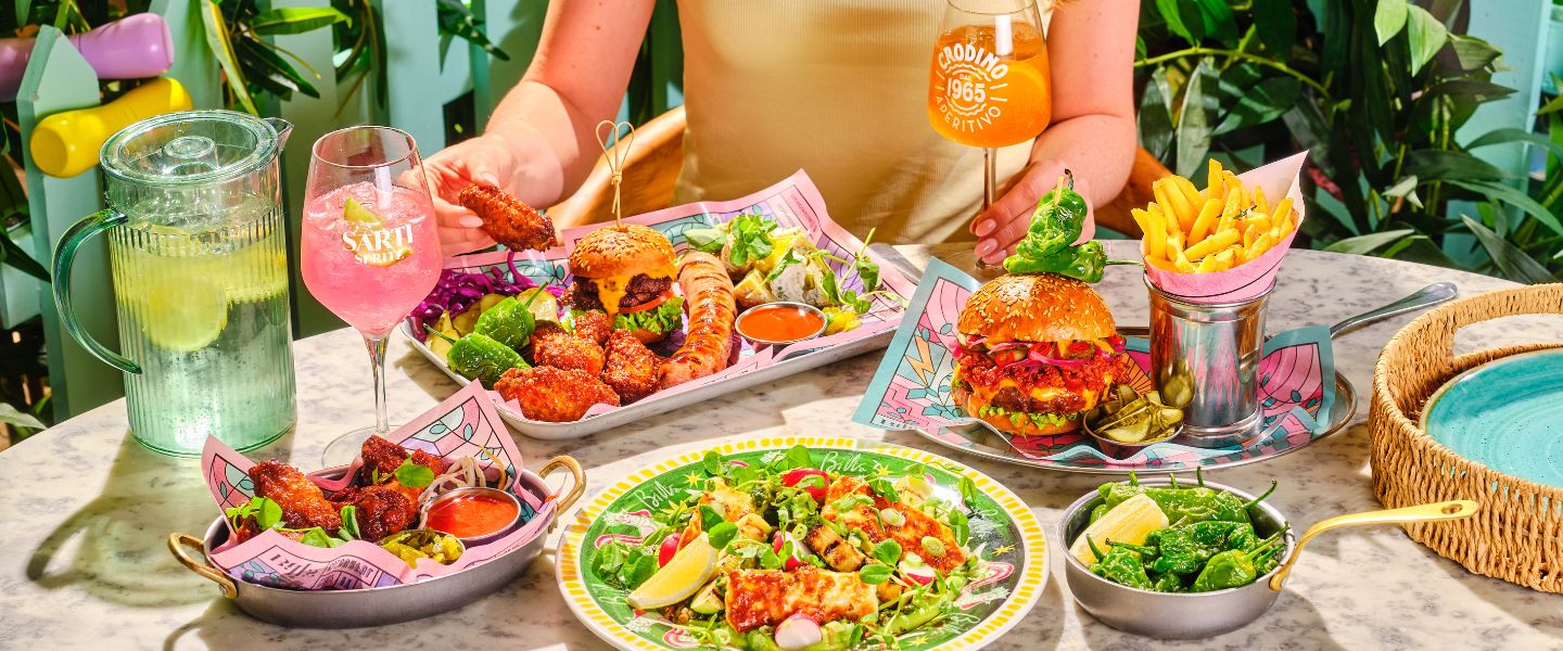 A table full of spritzes and summer dishes at Bill's