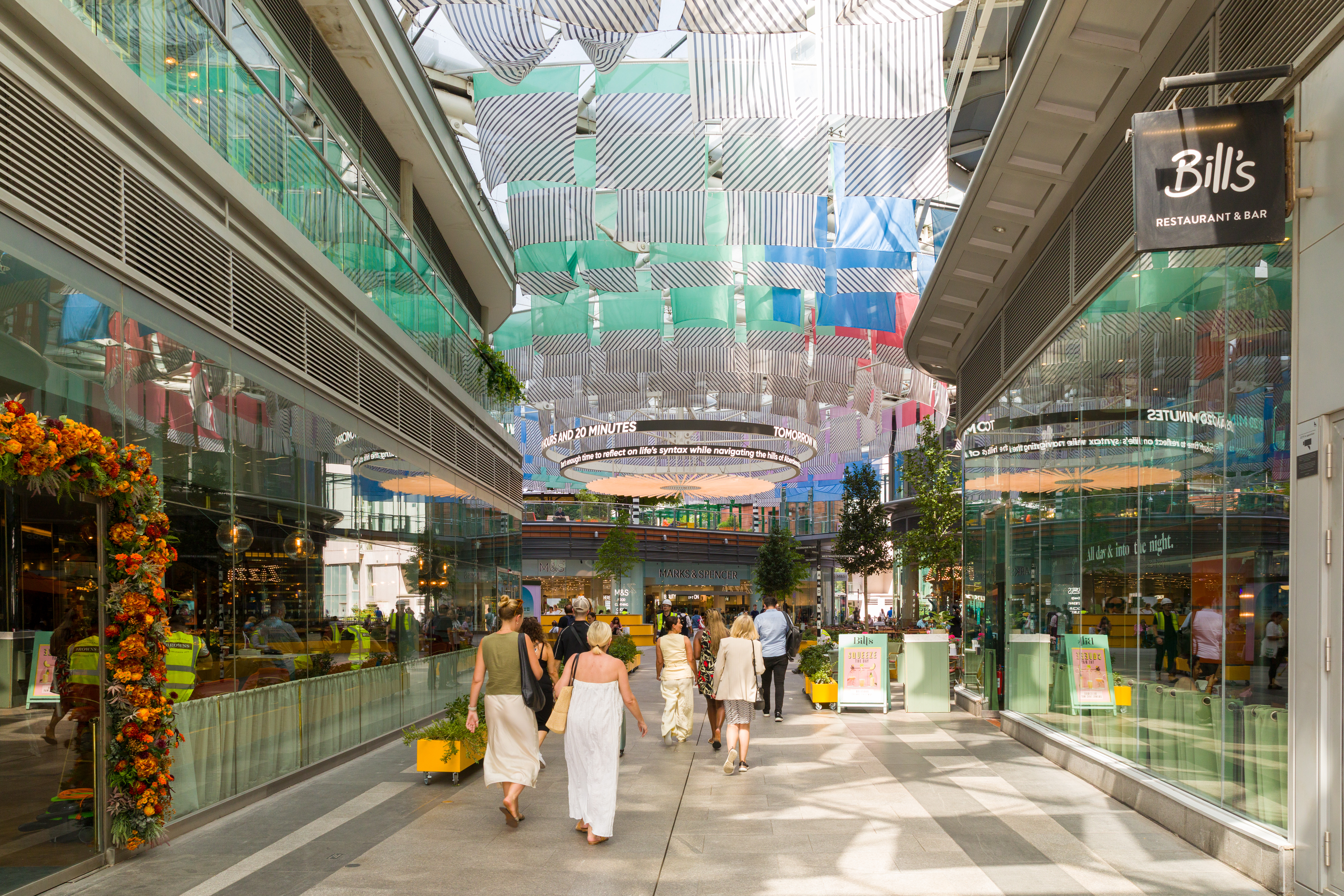 Tree-lined restaurant terraces at Cardinal Place, Victoria Street