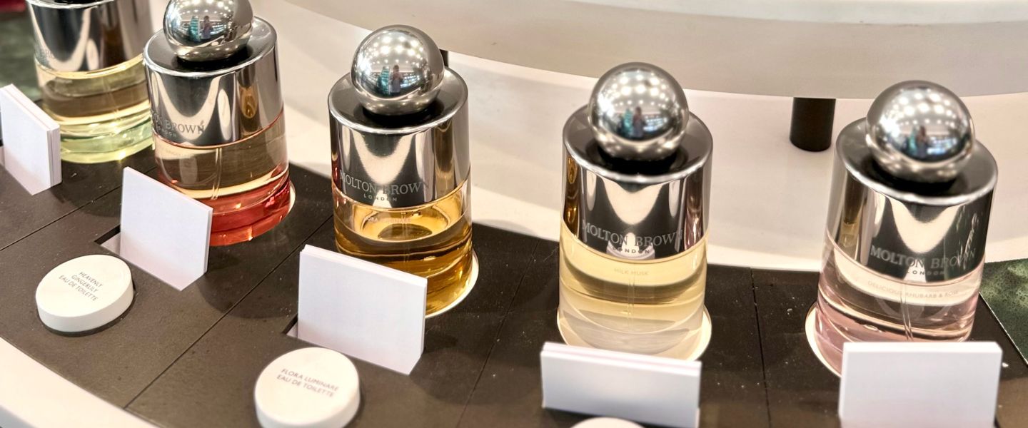A row of Molton Brown fragrances on display