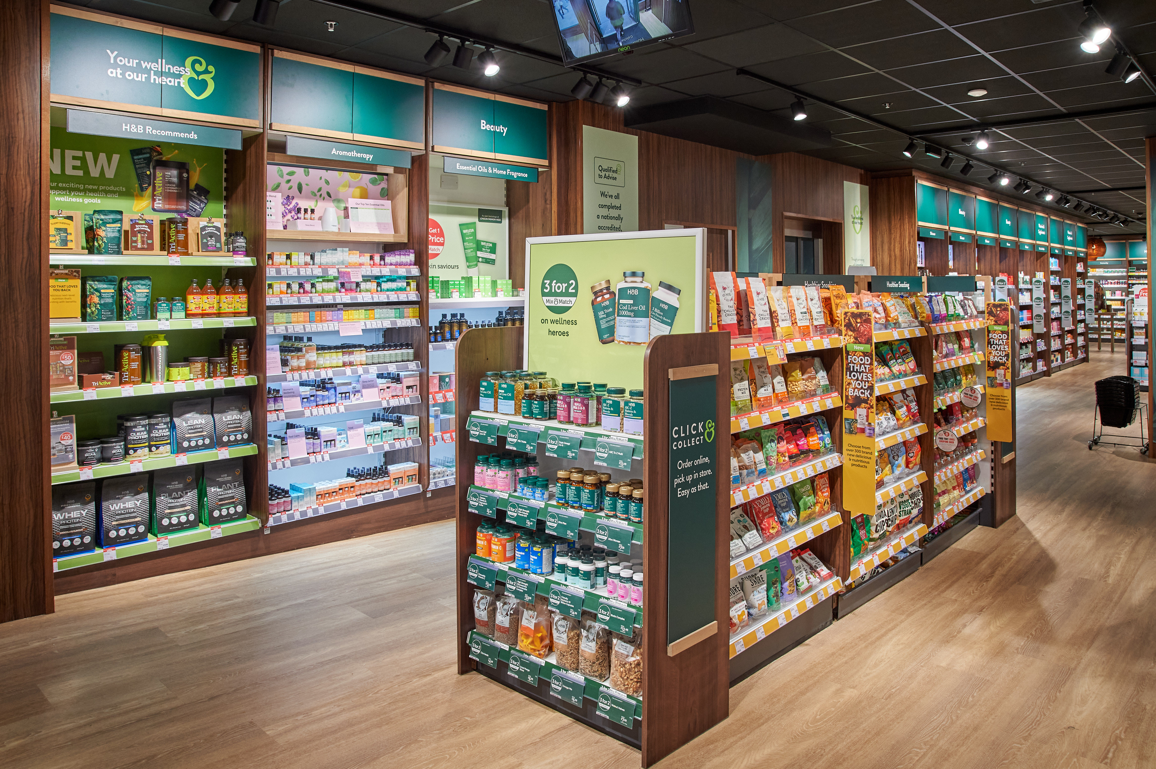 Inside of a Holland & Barrett store showcasing shelves full of products