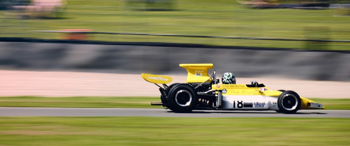 A yellow F1 car on the track