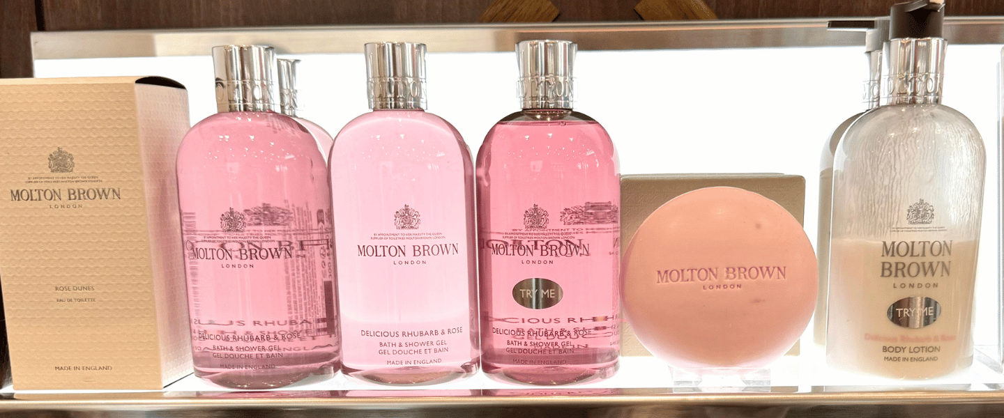 A row of pink Molton Brown shower gels and soaps