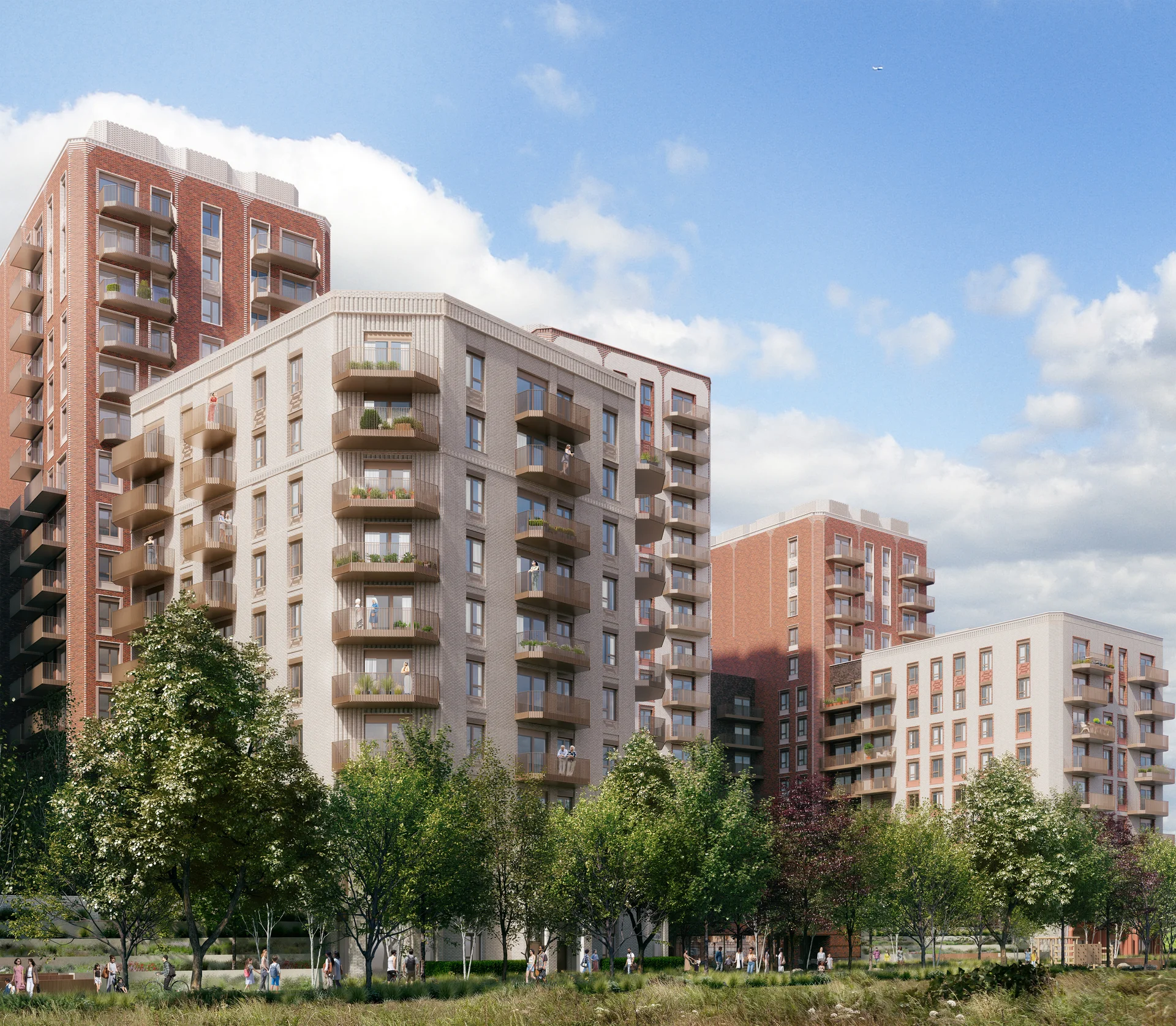 Wide view of the O2 Finchley Road redevelopment. High-quality red brick and light-colored residential towers with a public green space.