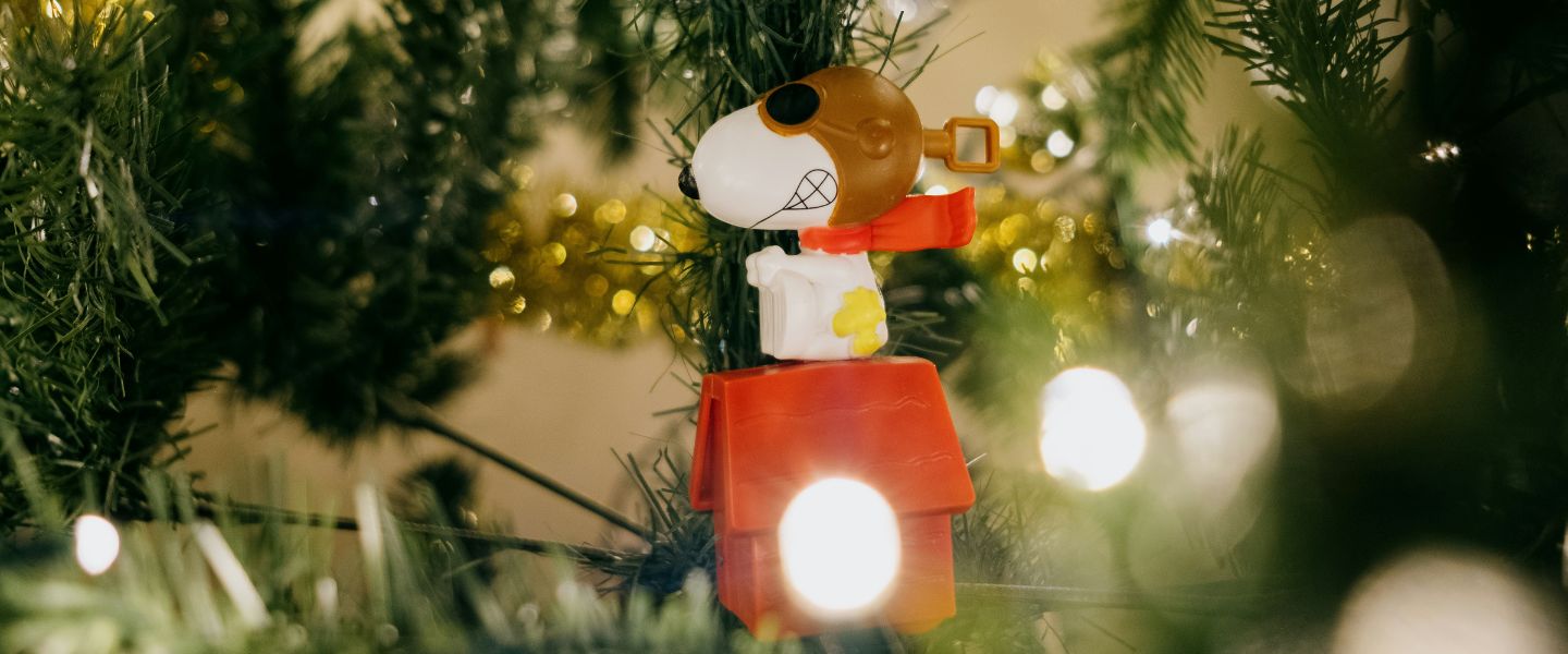 A Snoopy bauble on a tree