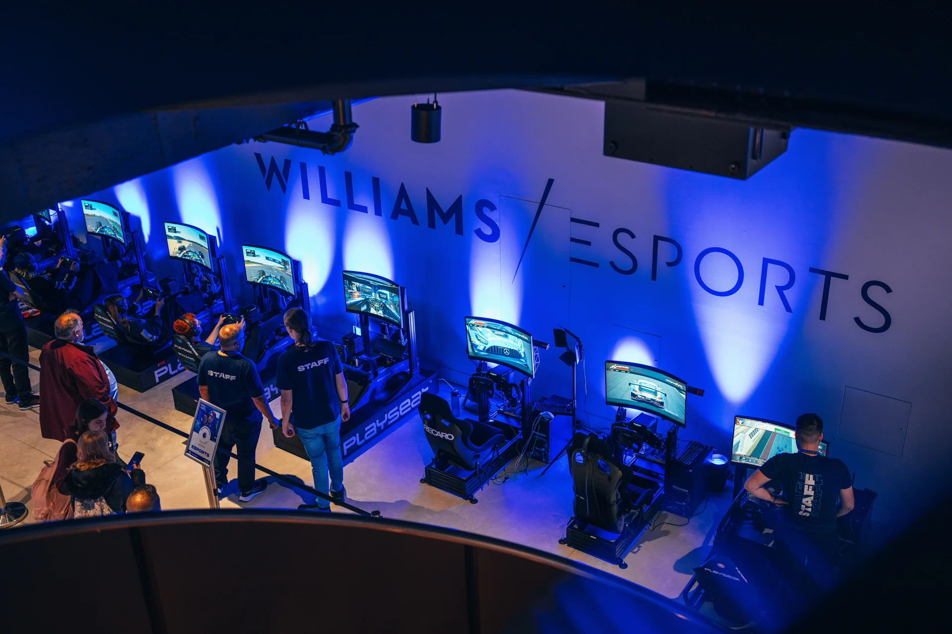 Interactive exhibition with people exploring displays and games themed around McVitie’s biscuits.