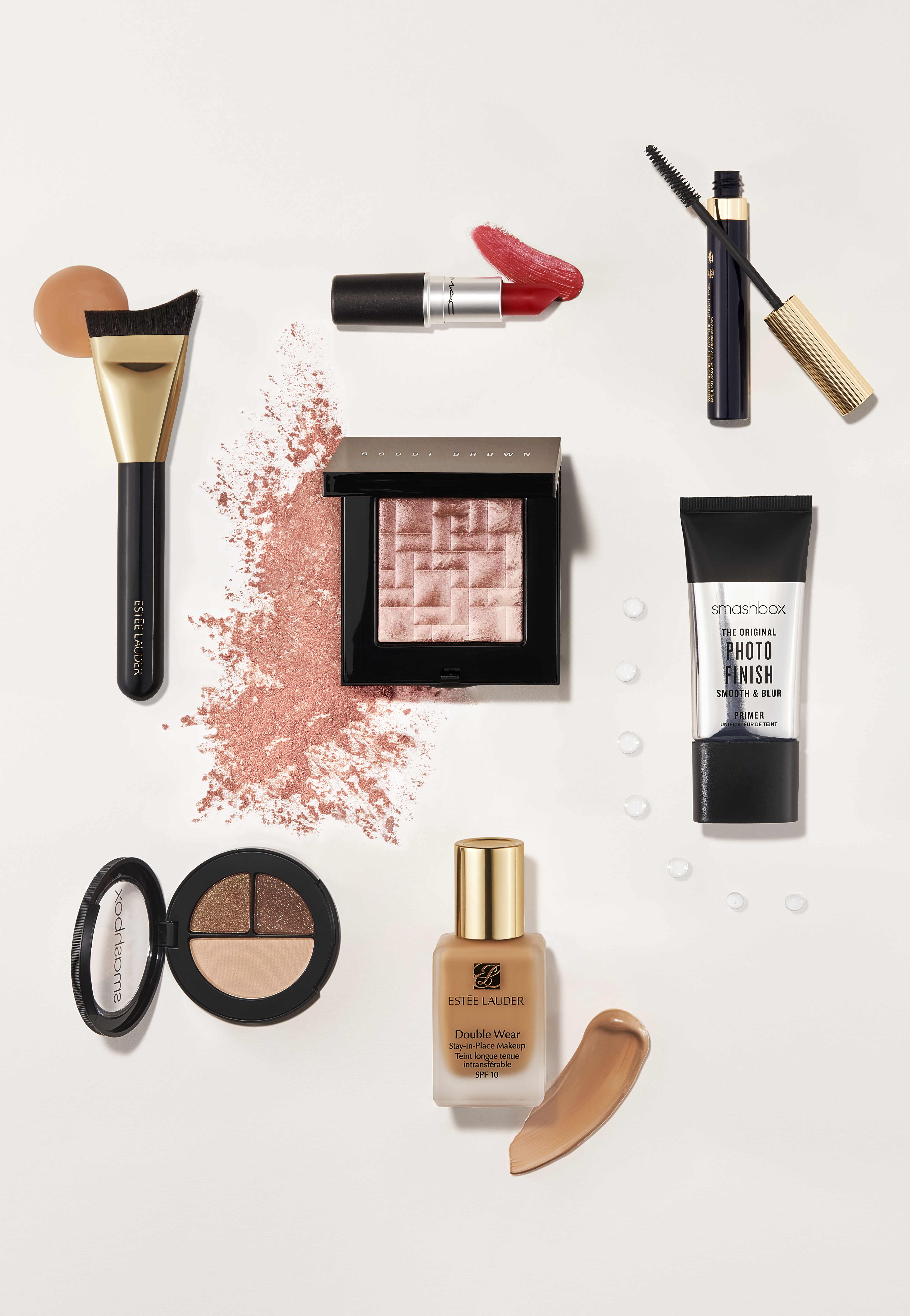 A selection of perfume bottles displayed with white lilies