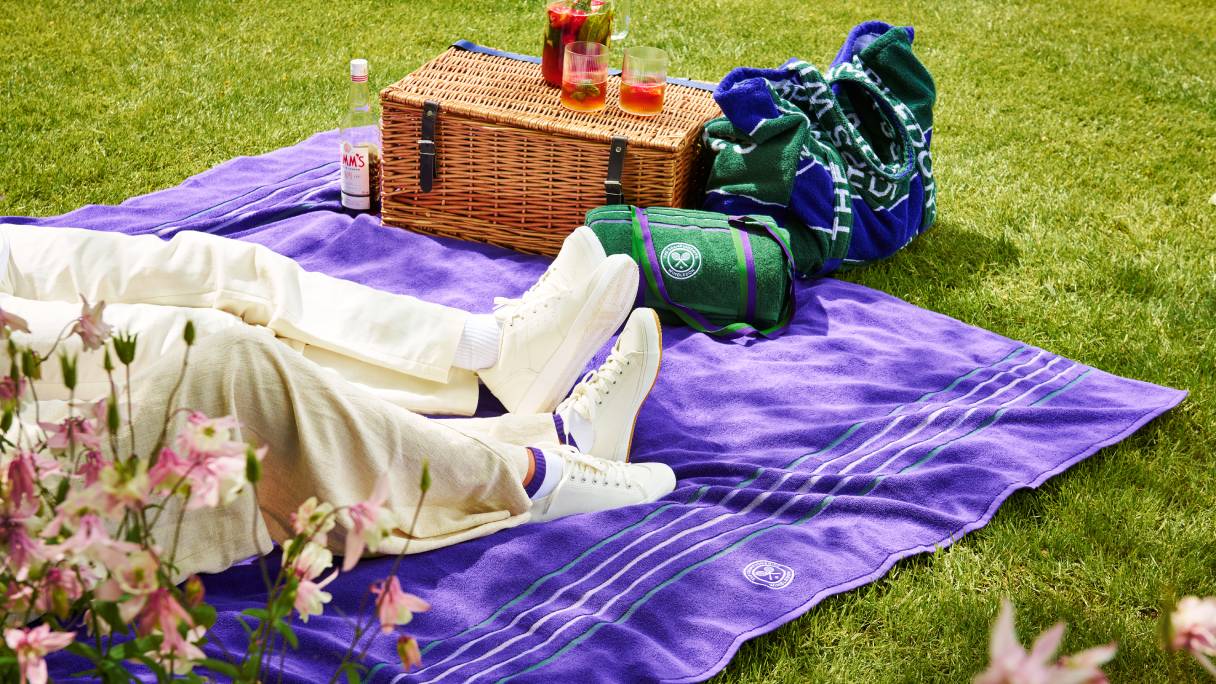 A Christy Wimbledon blanket with picnic hamper