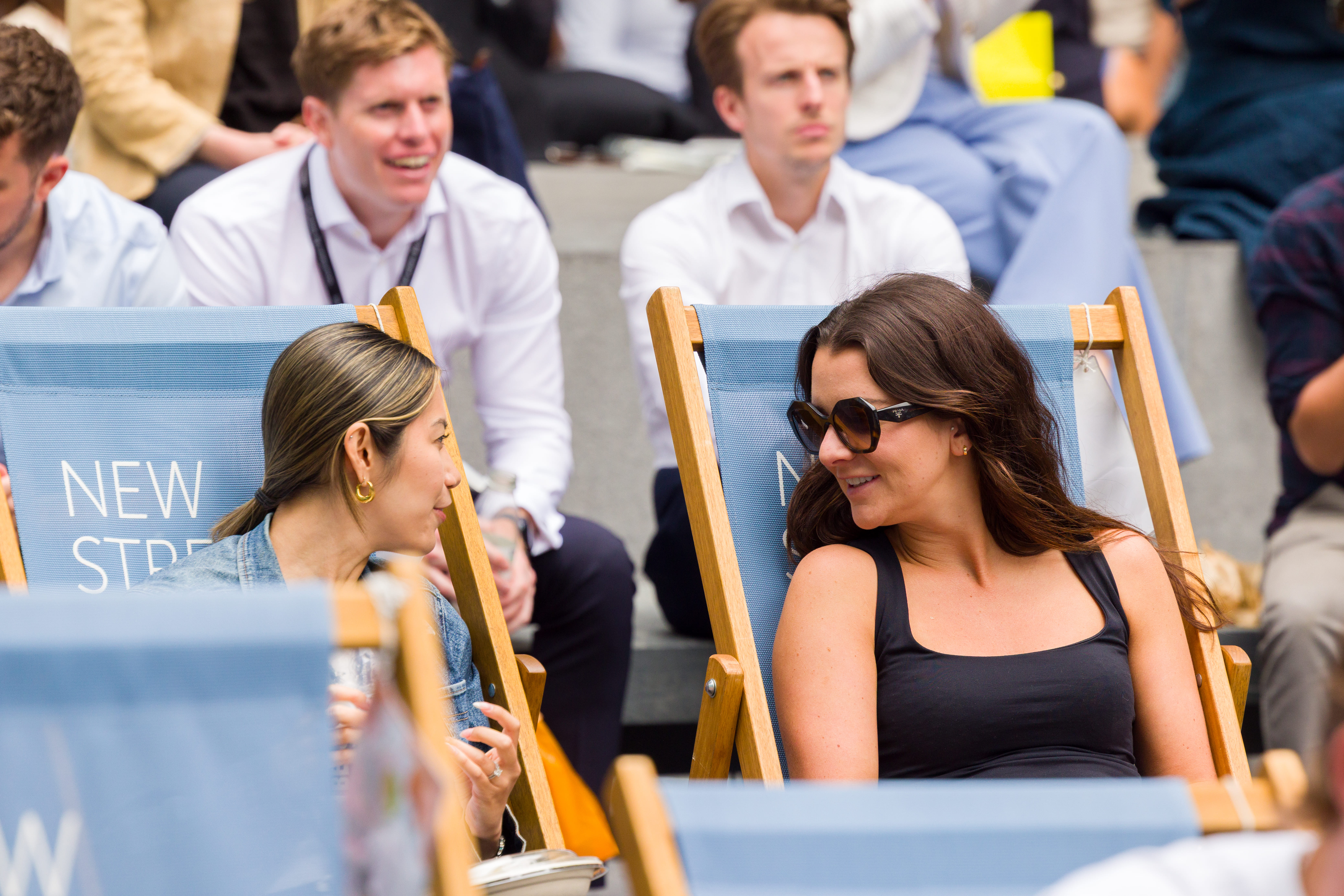 people on deckchairs at new street square