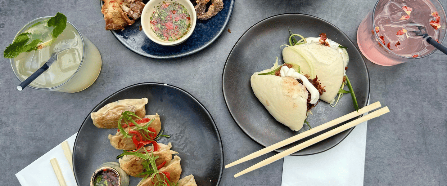 Areal shot of food plates on a black table