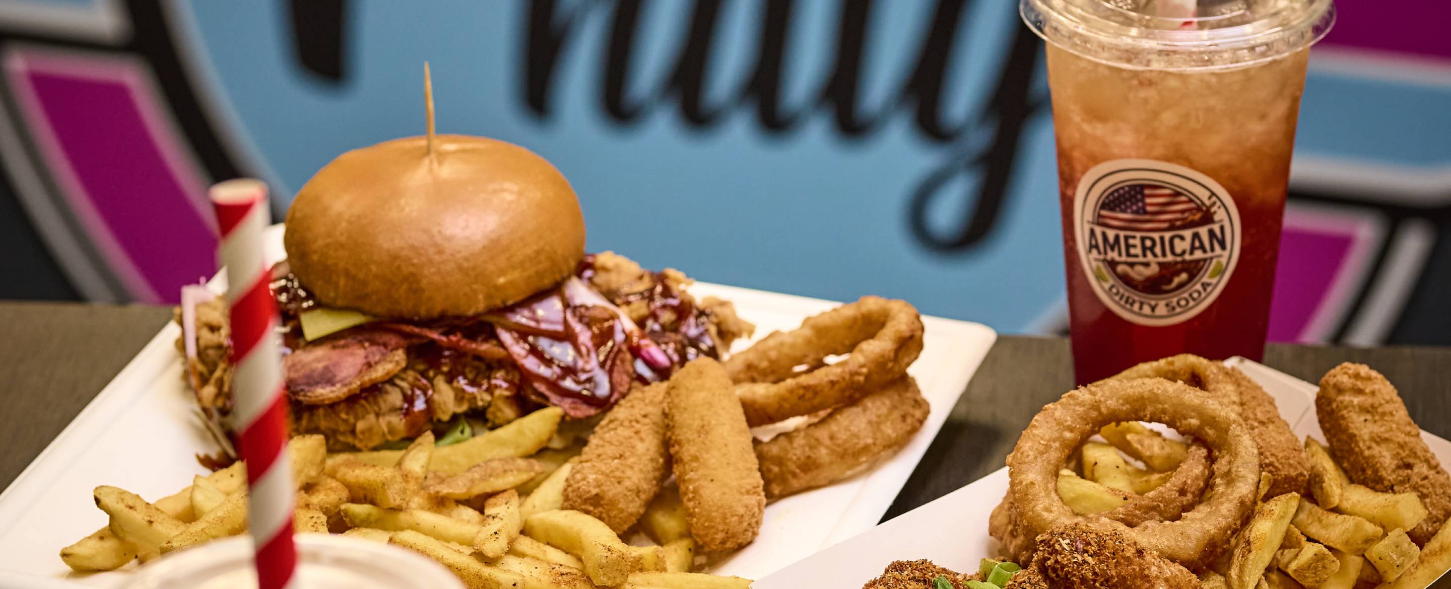 Burgers, fries, onion rings and an American Dirty Soda