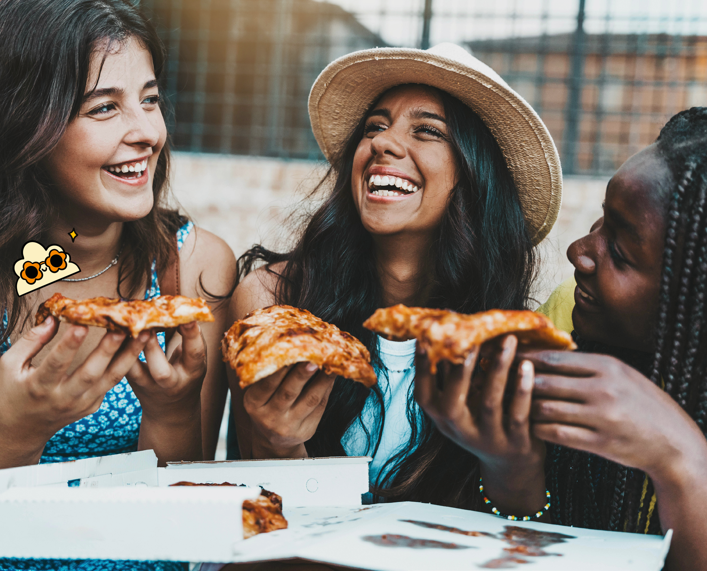 Friends smile together while holding a slice of pizza each