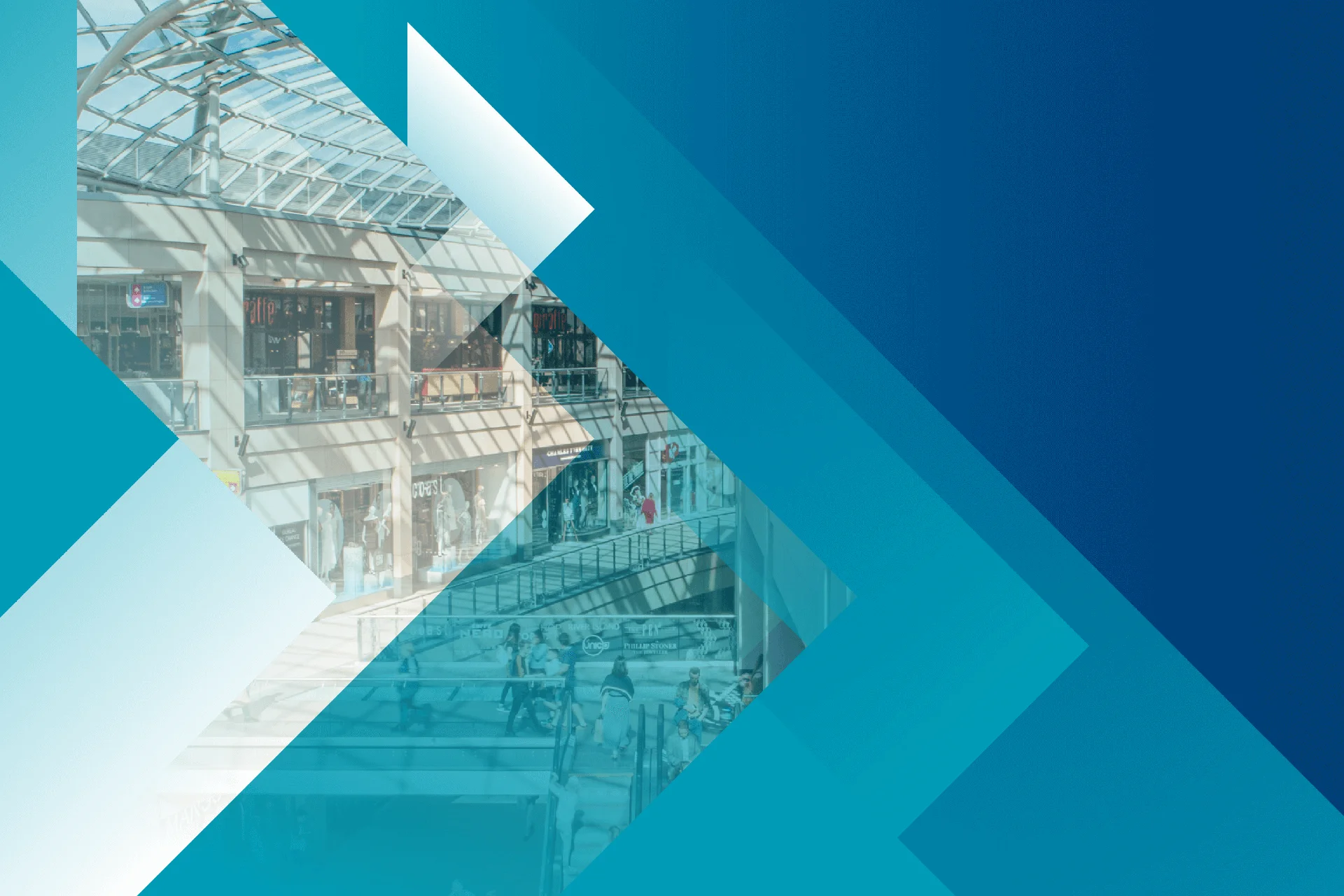 Interior view of a shopping mall with geometric blue overlay.